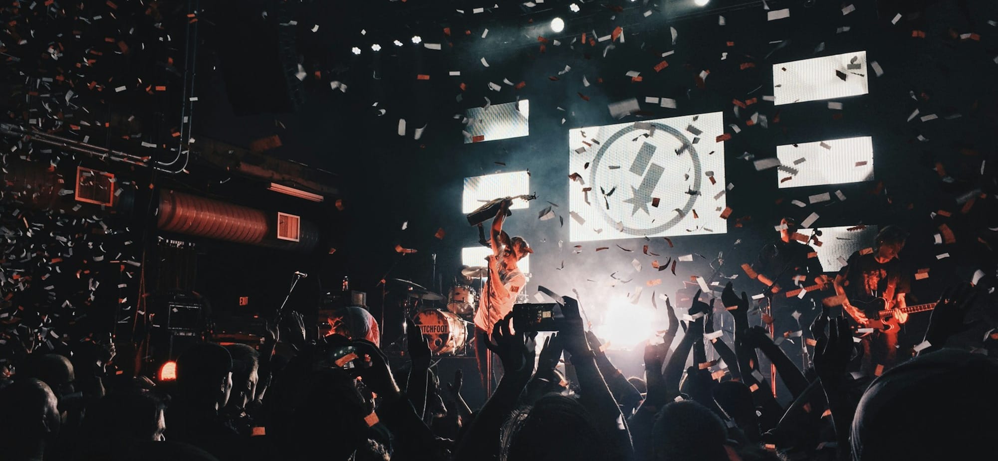 band playing instruments on stage