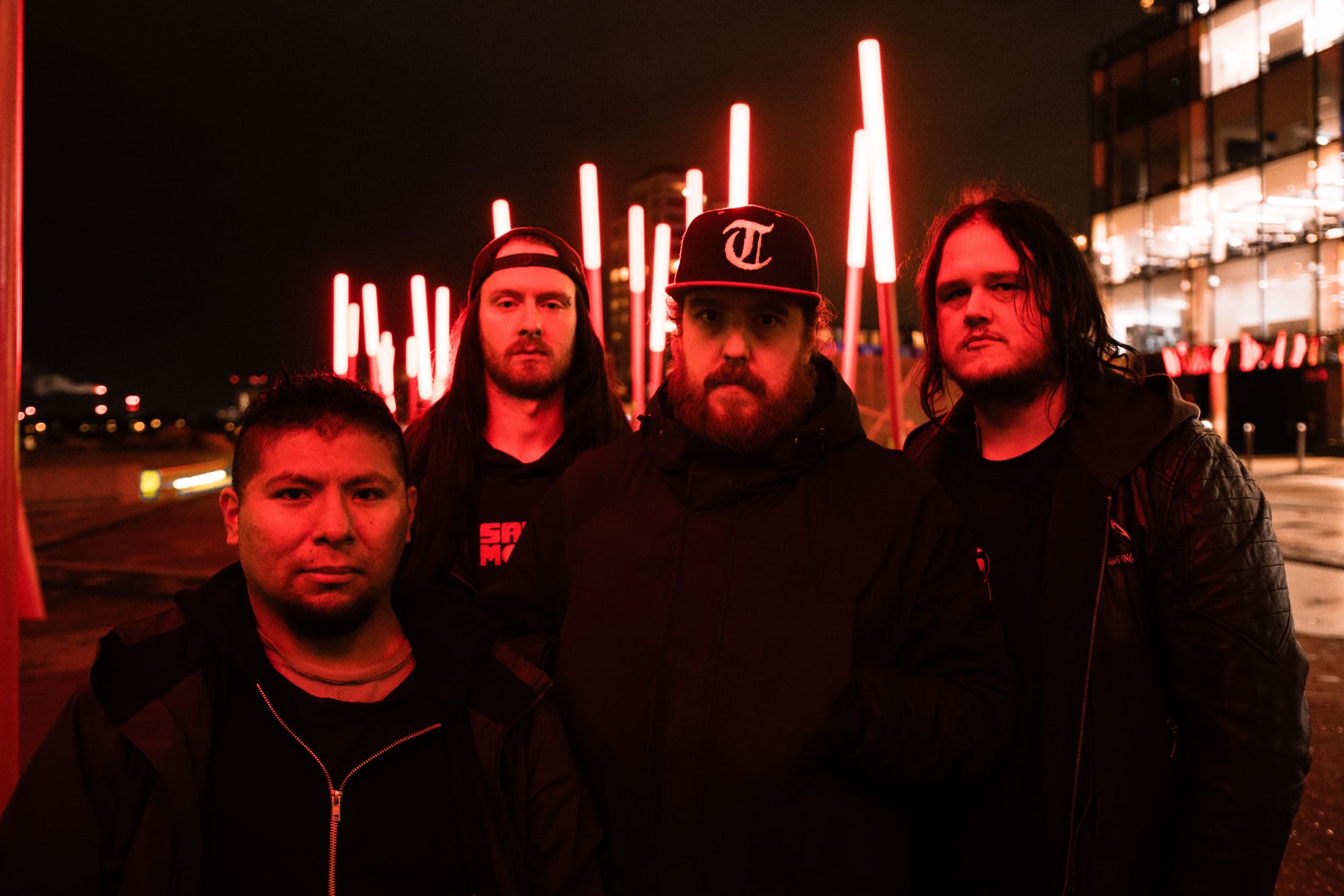 Irish Metalcore band Broken Habit Press Photo - all members standing on a city street under red lighting